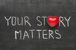 your story matters phrase handwritten on blackboard with heart symbol instead of O